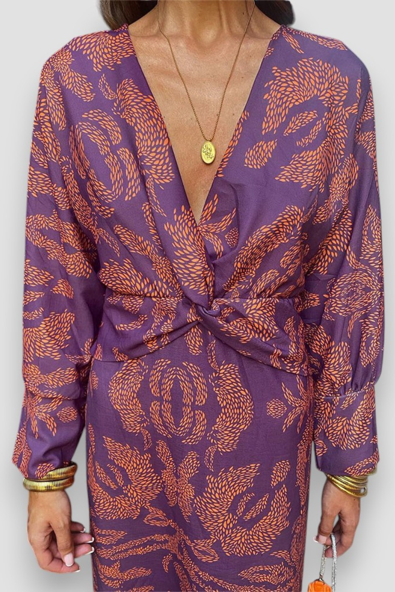 Elegante midi-jurk met twist-detail en bloemenpatroon – Tijdloos en stijlvol